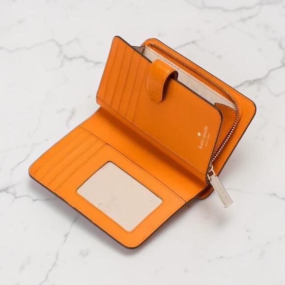 オレンジ色のZinniaの革KH787のケイト・スペードのレナの中型のBifold